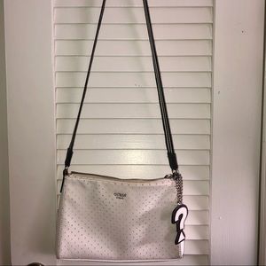 Guess White Crossbody Bag with “question symbol” chain tag , black & white strap